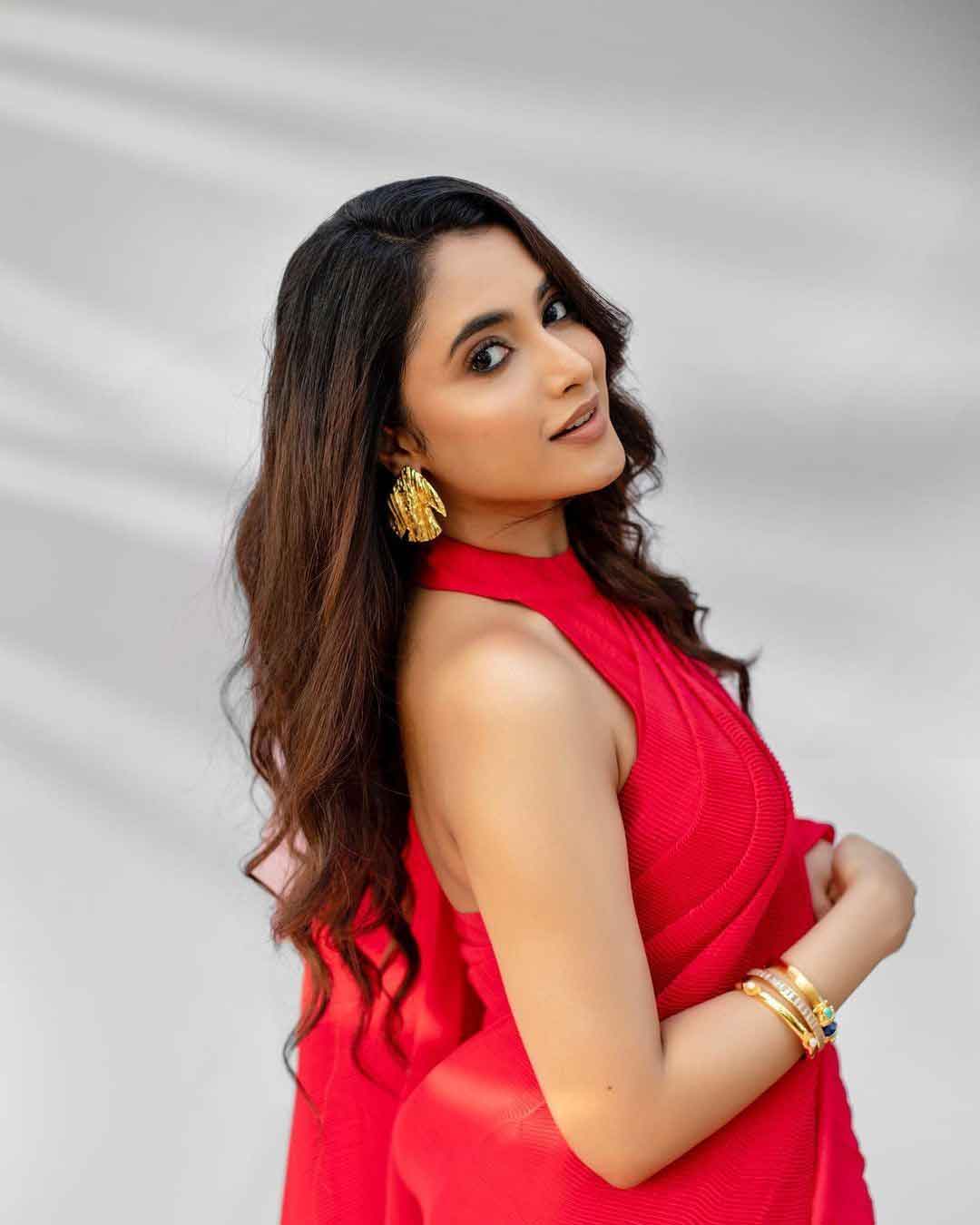 Priyanka Mohan Looks Fabulous in This Red Saree and Statement Earrings