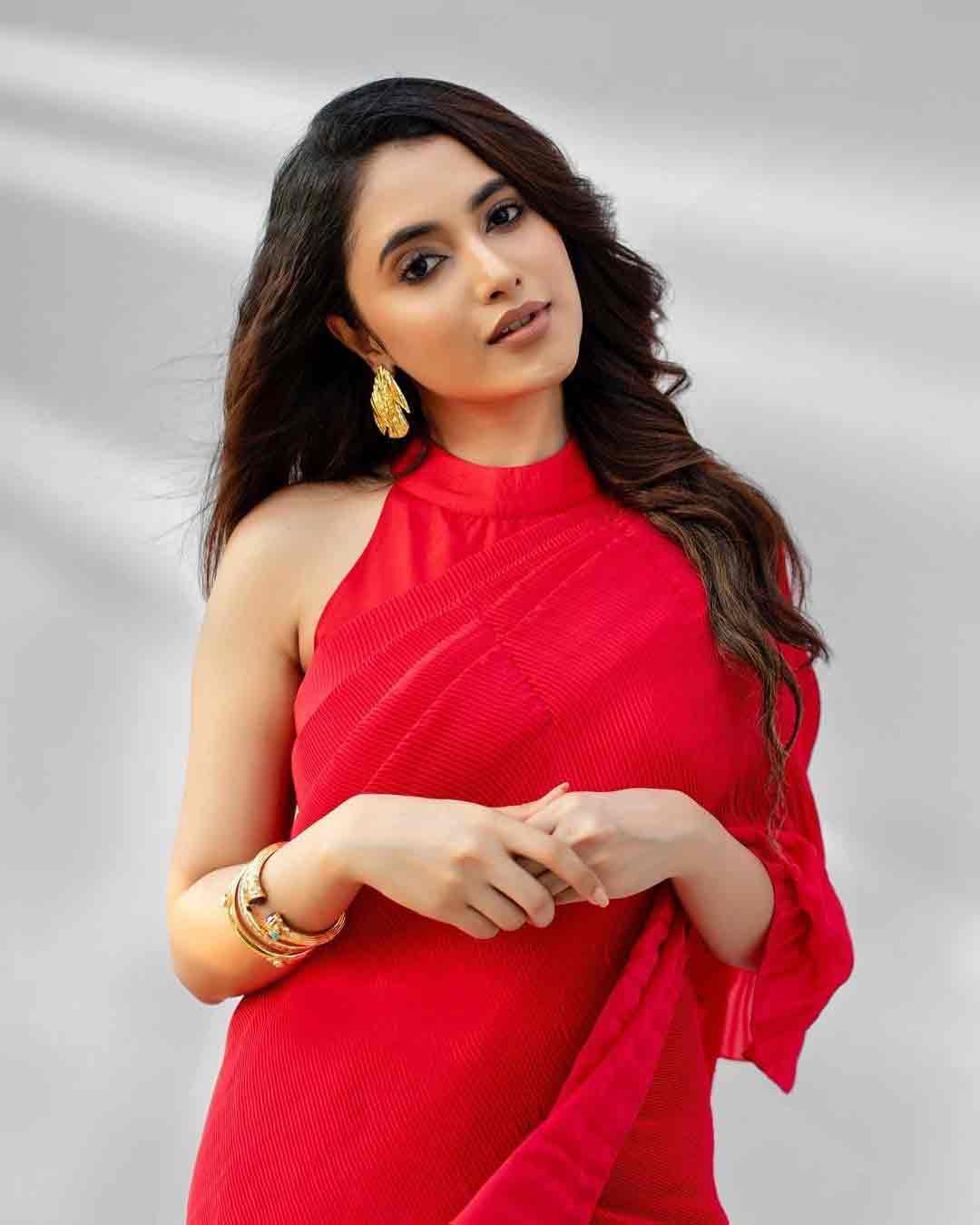 Priyanka Mohan Looks Fabulous in This Red Saree and Statement Earrings
