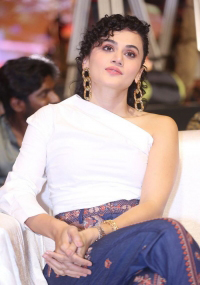 Taapsee Pannu looks fab in a white one-shoulder top, and royal blue printed trousers during the pre-release event of Mishan Impossible.