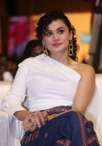 Taapsee Pannu looks fab in a white one-shoulder top, and royal blue printed trousers during the pre-release event of Mishan Impossible.